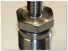 Electro-mechanical rod end made from heat treated 4140 steel.